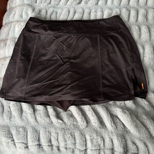 Lucy Running skort with built in ruffled compression shorts with pockets Size S